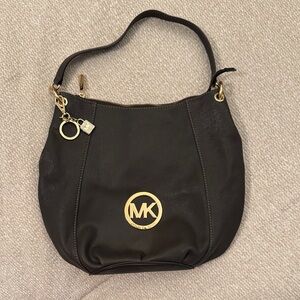 Michael Kors Black Hobo Bag with Gold Accents